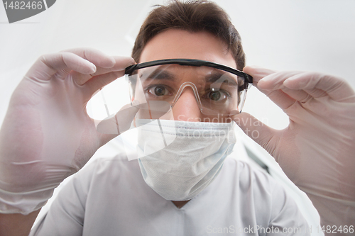 Image of Dentist adjusting eyewear