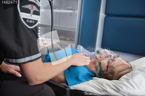 Image of Pulse Senior Woman in Ambulance