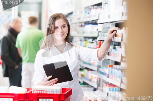 Image of Female Pharmacist Holding Tablet PC