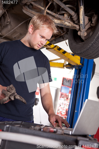 Image of Auto Mechanic with Laptop