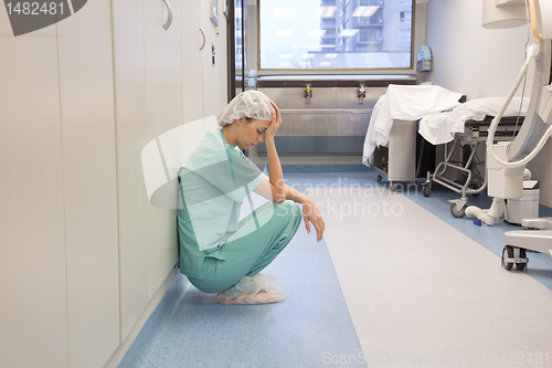 Image of Tired Doctor in Hospital Hallway