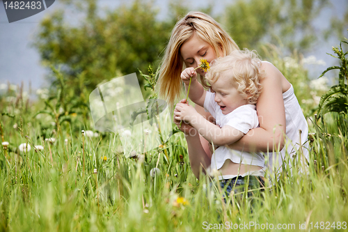 Image of Mother and Son in Grass Field