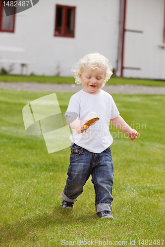 Image of Boy with Gardening Tool