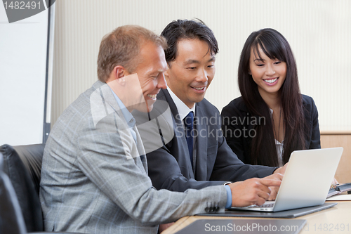 Image of Businesspeople working on laptop