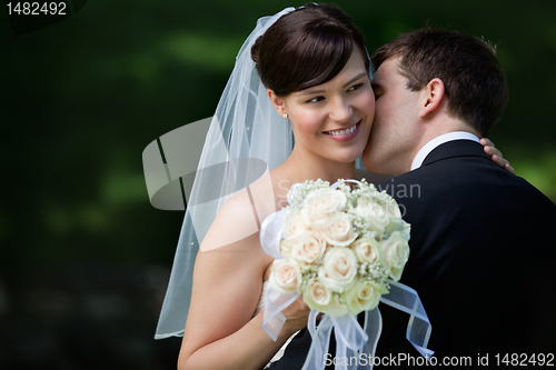 Image of Happy Kiss of Newlyweds