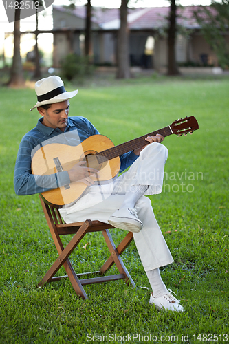 Image of Handsome Man Playing Guitar