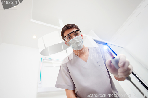 Image of Dentist with Ultraviolet Light