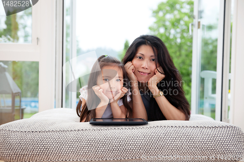 Image of Mother and Daughter with Digital Tablet
