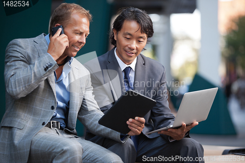 Image of Businessmen using electronic gadgets