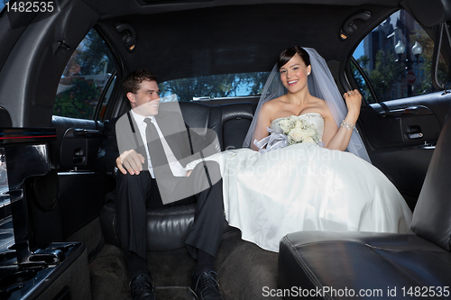 Image of Happy couple in limousine