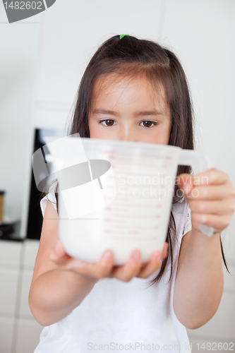 Image of Girl with measuring Cup