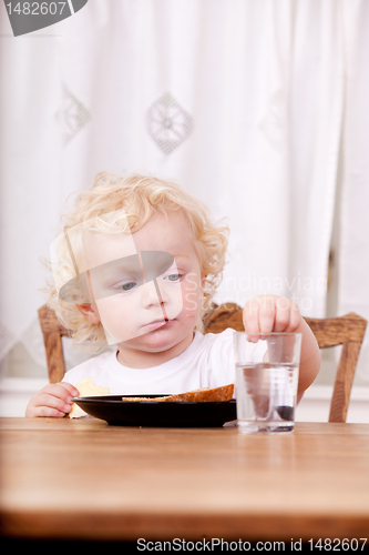 Image of Child Sitting at Table