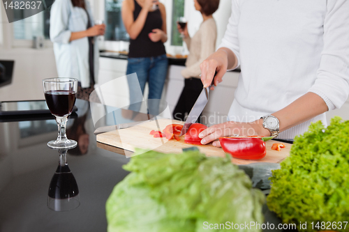 Image of Cropped image of female cutting vegetables