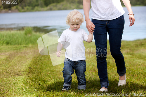Image of Mother and Son Walking Near Lake