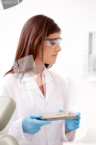 Image of Dentist with Tools