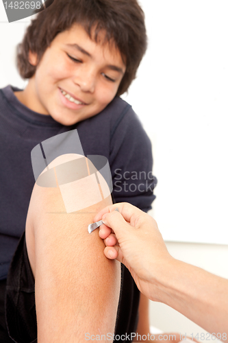 Image of Young Male Receiving Shonishin Acupuncture