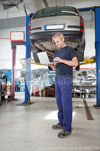 Image of Mechanic using laptop