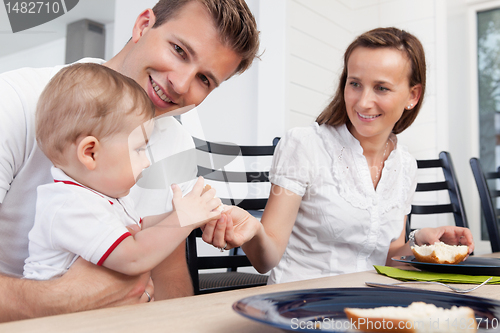 Image of Family sitting at breakfast table