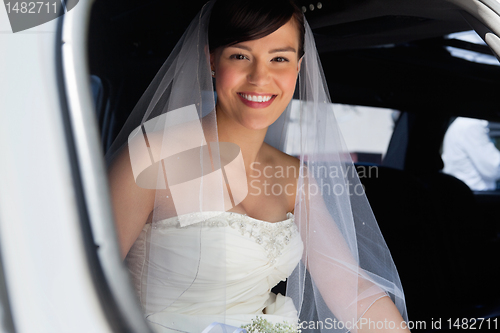 Image of Happy Bride in Limo