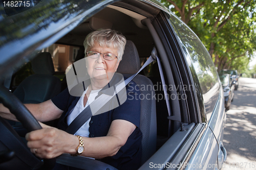 Image of Old woman driving car