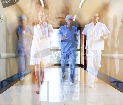 Image of Team of doctor and nurse running