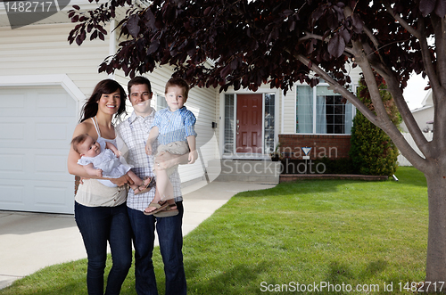 Image of Happy Couple Standing With Their Children