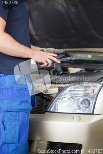 Image of Mechanic with Digital Tablet