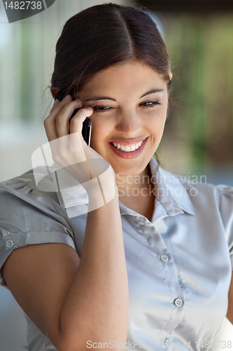 Image of Happy Woman on Call
