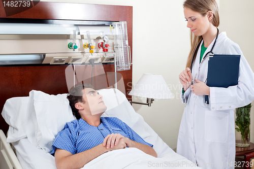 Image of Patient consulting doctor