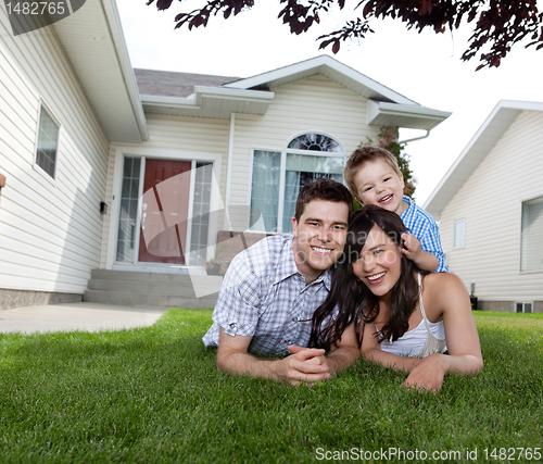 Image of Happy Family Lying on Grass