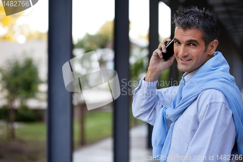 Image of Handsome Guy Talking on Cell Phone