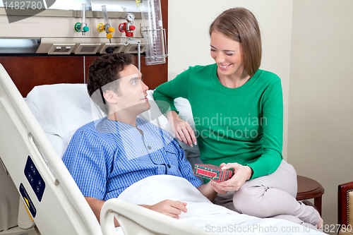 Image of Wife giving present to husband