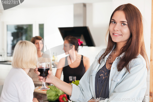 Image of Young woman with a glass of wine