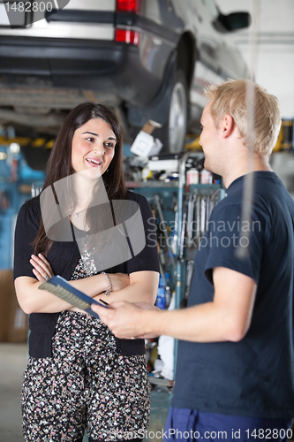 Image of Female Customer in Mechanic Shop