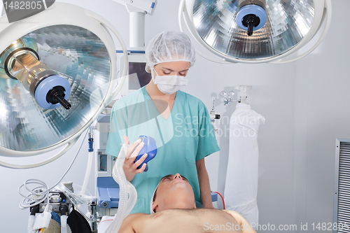 Image of Doctor applying oxygen mask