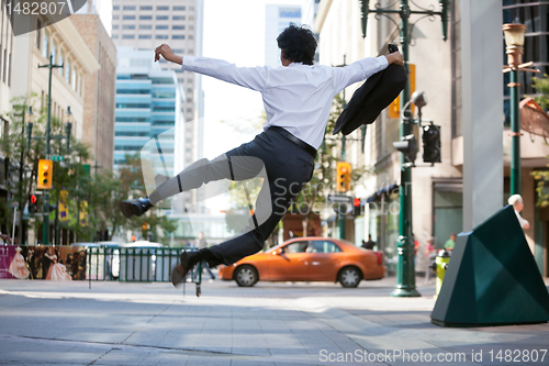 Image of Business Man Jumping in Air