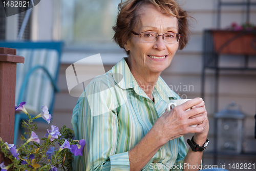 Image of Senior Woman with Warm Drink Outdoors