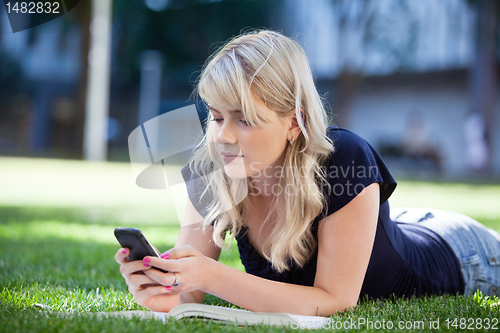 Image of Young girl using cell phone