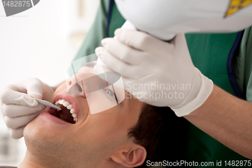 Image of Dentist Preparing X-Ray