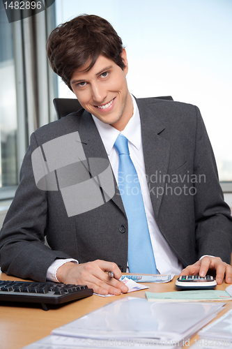 Image of Businessman Calculating Budget