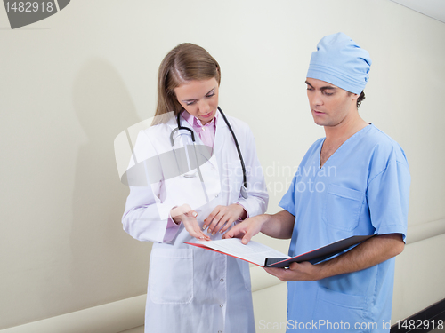 Image of Doctor and nurse studying information