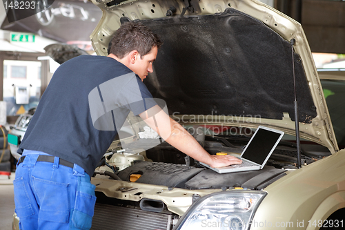 Image of Mechanic using laptop