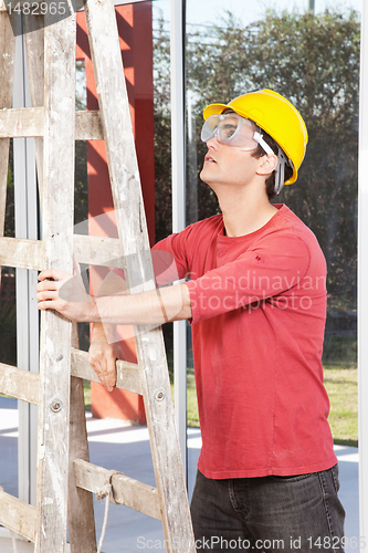 Image of Architect holding ladder