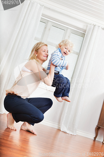 Image of Mother playing with boy