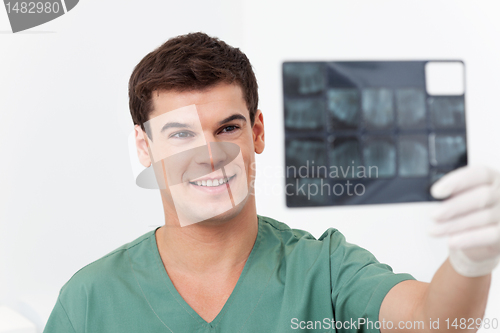 Image of Dentist holding X-Ray