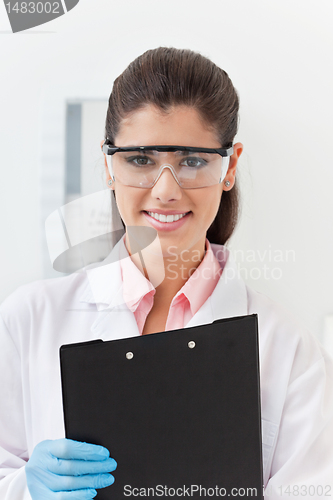 Image of Dentist with a clipboard
