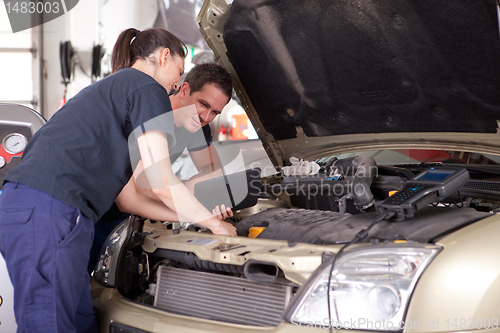 Image of Mechanic using Digital Tablet