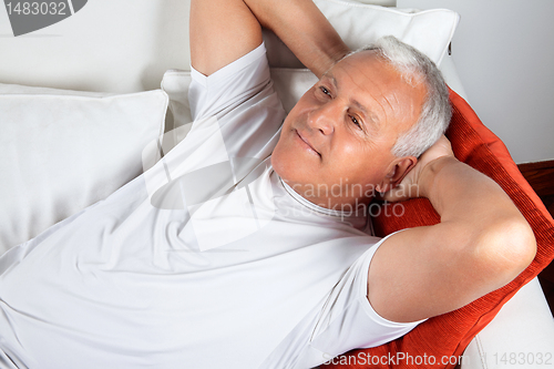 Image of Elderly Man Lying in Sofa