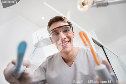 Image of Dentist holding dental tools