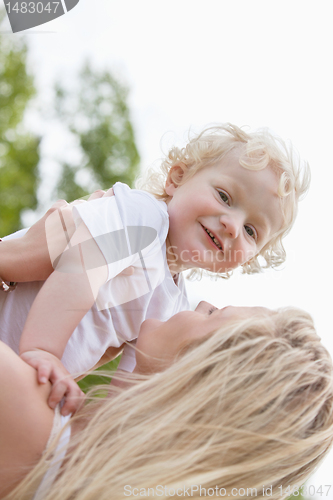 Image of Baby and mother in playful mood